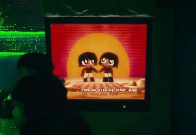 a person standing in front of a flat screen tv