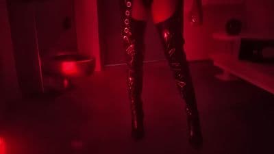 a woman is standing in a dark room