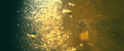 a close up view of a window with rain drops