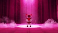 a red and white robot standing on a stage