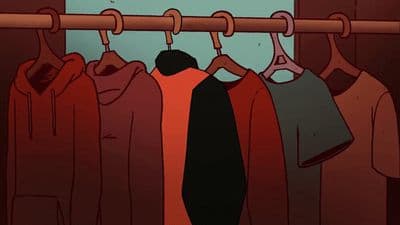 a bunch of clothes hanging on a rail