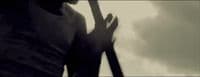 a silhouette of a person holding a baseball bat