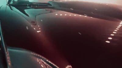 a car driving down a highway at night