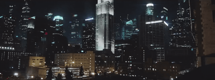 a view of a city at night from a rooftop