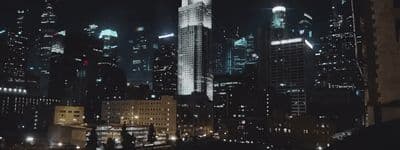 a view of a city at night from a rooftop