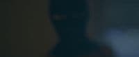 a blurry image of a person in a dark room