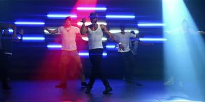 a group of people dancing on a stage