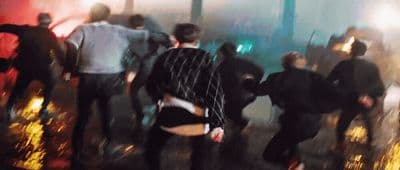 a blurry photo of a group of people dancing