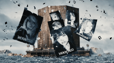 a bunch of pictures hanging from the side of a building