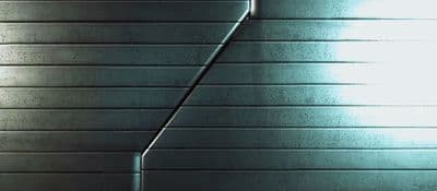 a white toilet sitting in a bathroom next to a wall