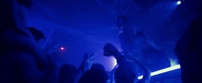 a group of people standing on top of a stage