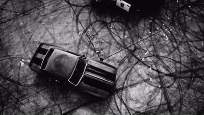 a black and white photo of a parked car
