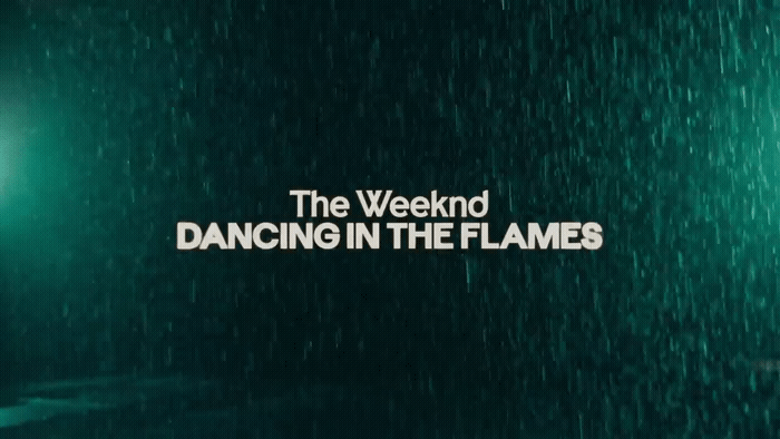 a green wall with the words dancing in the flames