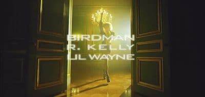a woman walking into a doorway with the words birdman r kelly ill wayne