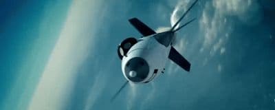 a white and black airplane flying through the sky