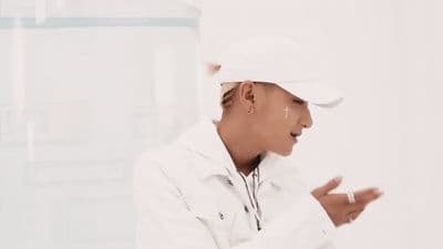a person in a white shirt and a white hat