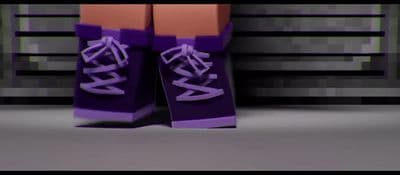 a pair of purple shoes sitting on top of a counter