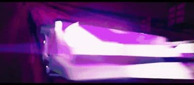 a blurry image of a bed in a room