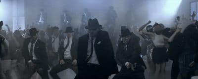 a group of people dancing in a room