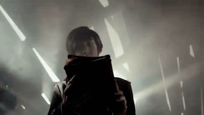 a person standing in a dark room with a book
