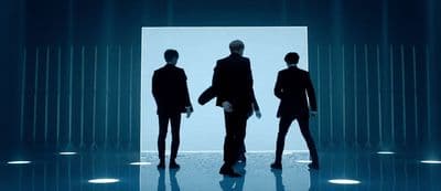 a group of people standing in front of a doorway