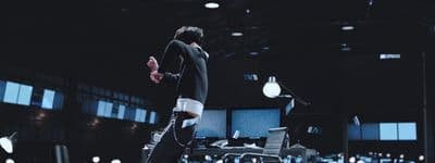 a man is standing in a dark room