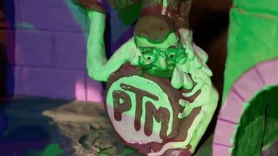 a statue of a man holding a sign that says pmp