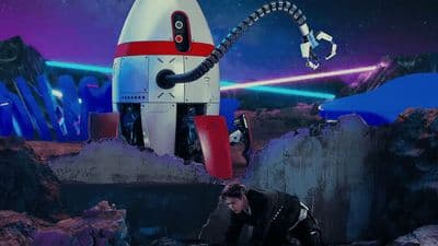 a man kneeling down in front of a robot