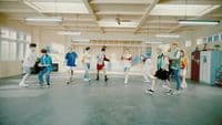 a group of people walking around in a room