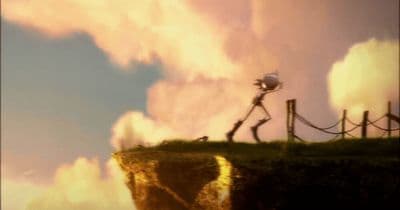 a man standing on top of a cliff