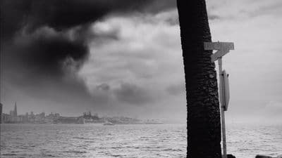 a black and white photo of a boat in the water