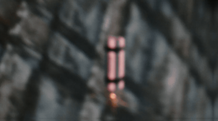 a blurry photo of a red object on a wall