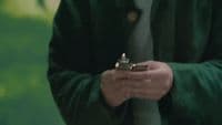 a man holding a cell phone in his hands