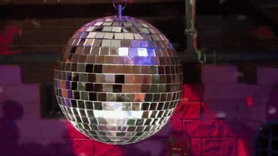 a disco ball hanging from a ceiling in a room