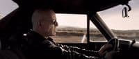 a man driving a car on a highway