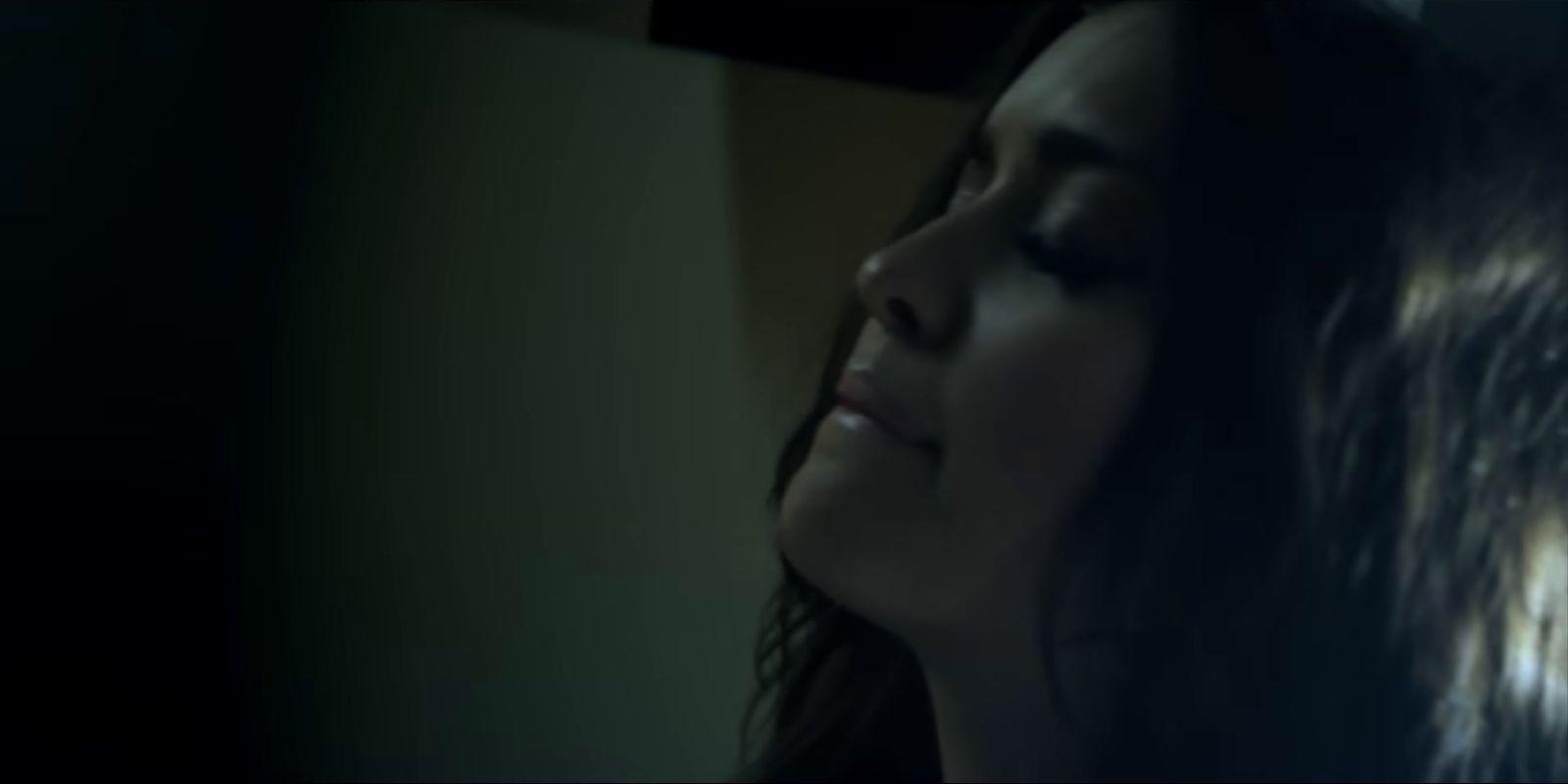 a close up of a person with her eyes closed