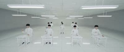 a group of people sitting in chairs in a room