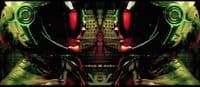 a green and red robot with a red light
