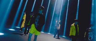 a group of people standing on a runway