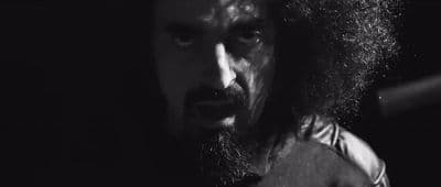 a man with long hair and a beard