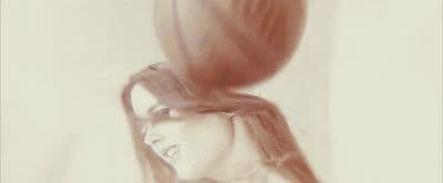 a woman with her hair blowing in the wind