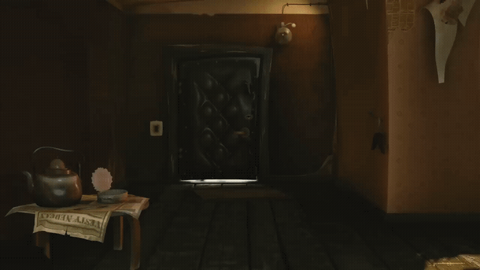 a room with a wooden floor and a black door