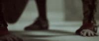 a close up of a person's legs and feet