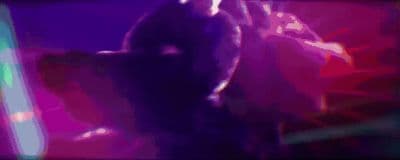 a blurry image of a person holding a cell phone
