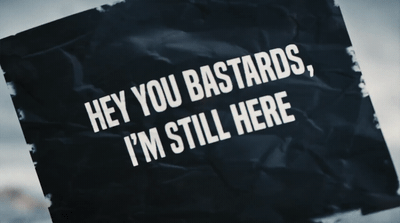 a sign that says hey you bastards, i'm still here