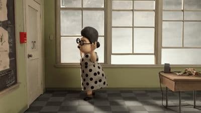 a woman in a polka dot dress talking on a cell phone