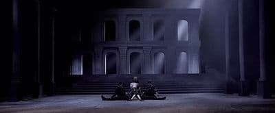 a group of people sitting on top of a stage