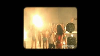 a group of people standing around each other
