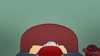 a person laying in a bed with a red pillow