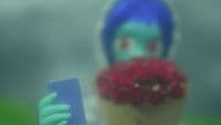 a blurry image of a person holding a cell phone